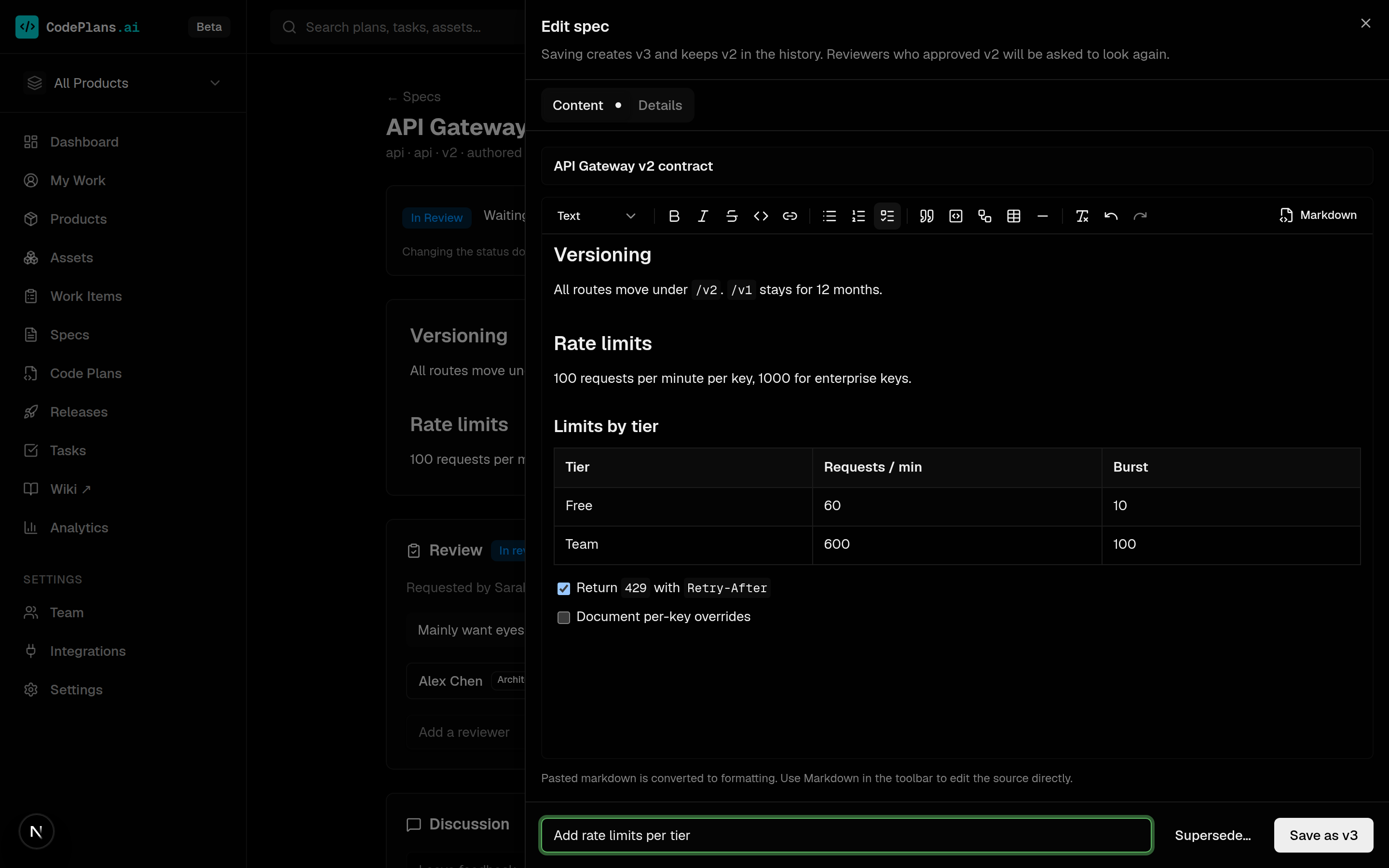 The slide-in spec editor with a pasted markdown table and task list